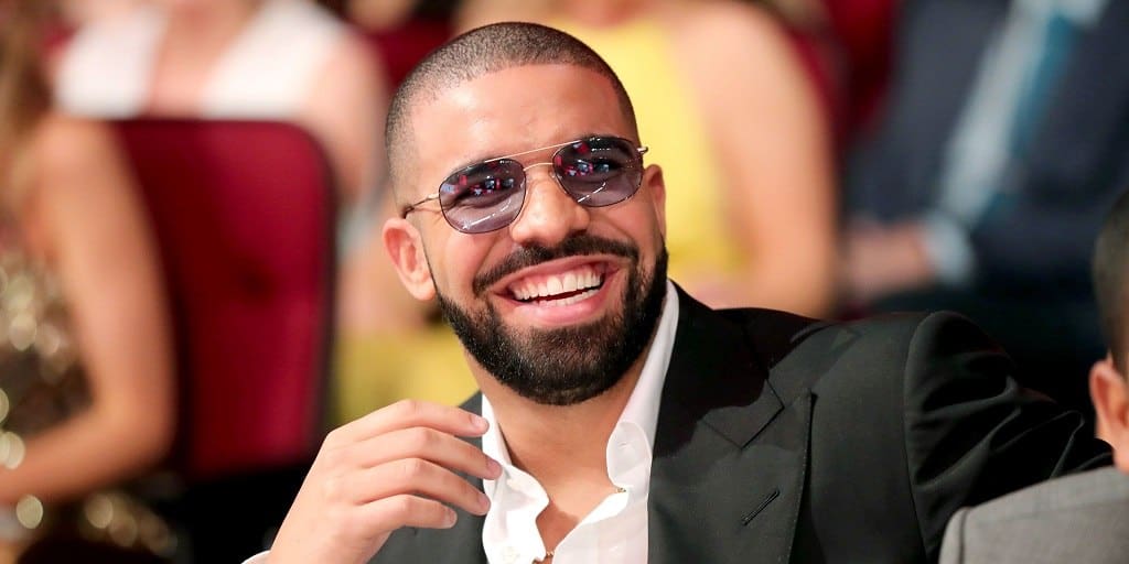 Drake With Short Beard and Glasses Smiling