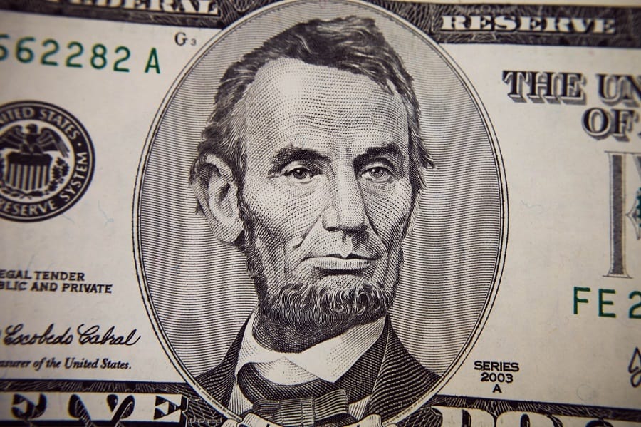 Abraham Lincoln's face of the U.S. penny and five-dollar bill