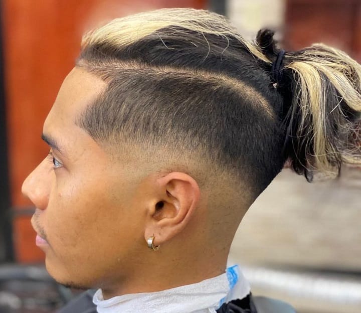 Bleahed Undercut Bun2 ponytail hairstyles
a man with a ponytail
back ponytail boy
