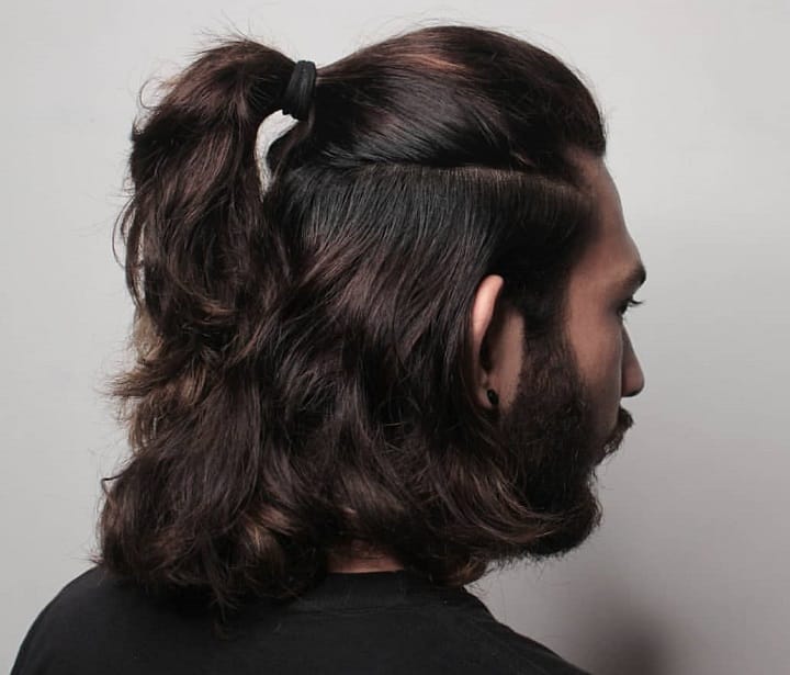 Half-Down, Half-Up braids in a ponytail man
curly hair ponytail male
curly hair ponytail man
