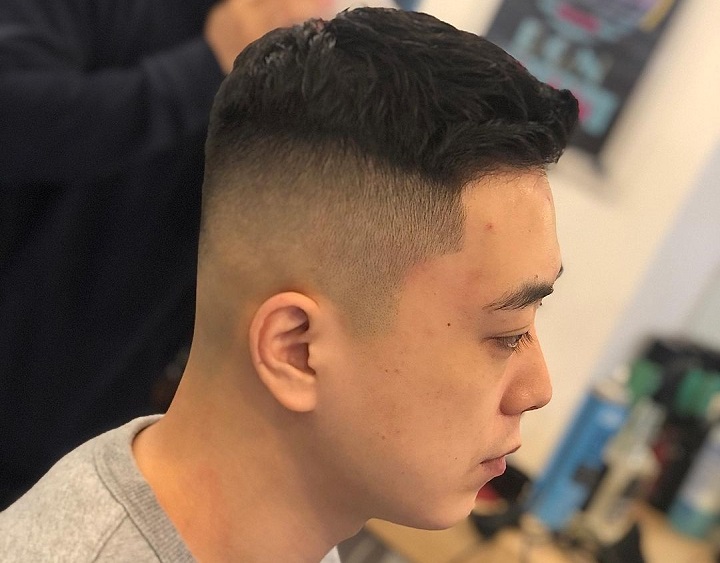 High Fade And Wavy Topround asian face haircut male
side swept undercut asian
square face asian haircuts male
