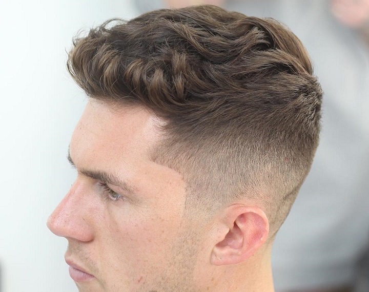 Burst Fade Faux Hawkman haircut mid fade
medium fade en v
medium fade for men
