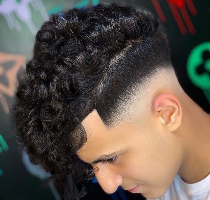 Curly Undercut Mohawk Long Bangsmid fade undercut curly hair
undercut men curly hair
curly hair with undercut
