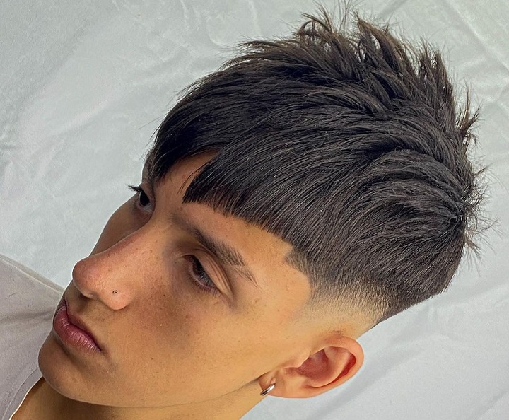 Disconnected Undercutdesigns for mid fade
fade bangs
fade haircut men medium hair
