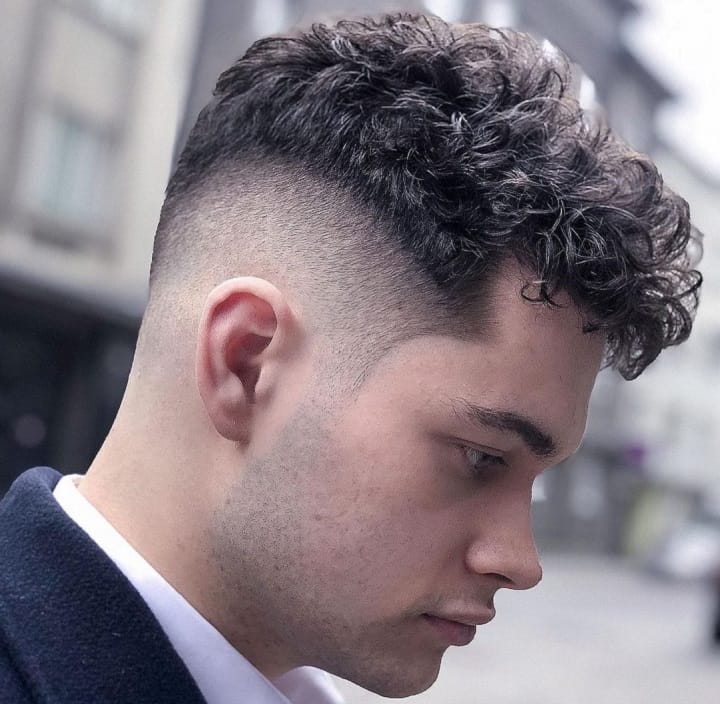 Hard Fade With Curlsmale curly hair undercut
male curly undercut
men undercut curly hair
