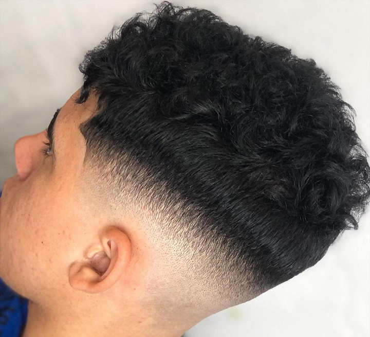 Low Fade Wavy Haircool mid fade designs
corte mid fade
curly top mid fade
