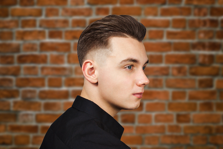 Pensative Young Man With Faded Pompadour Hair