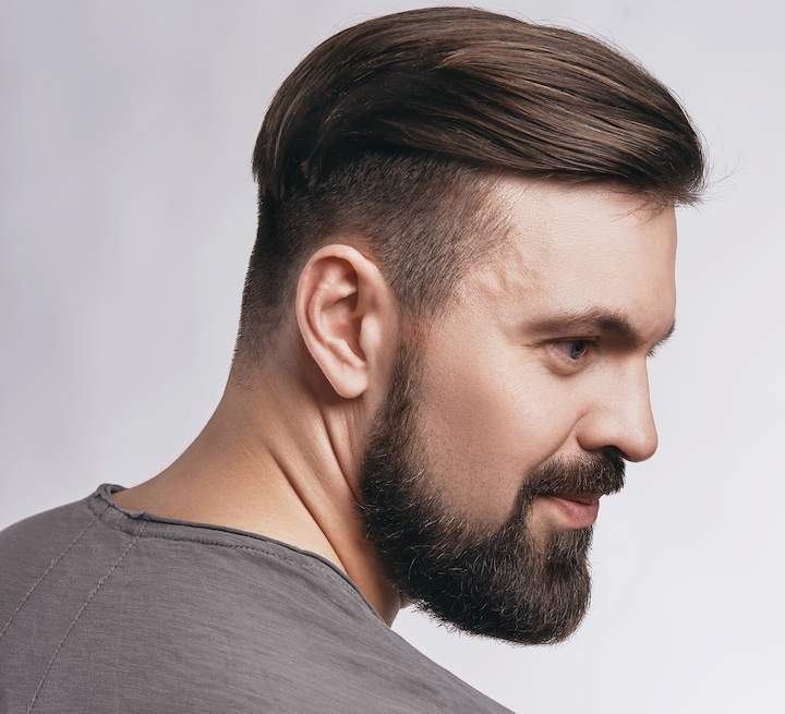 Smiling Man With Beard and Modern Slicked Fade Hair