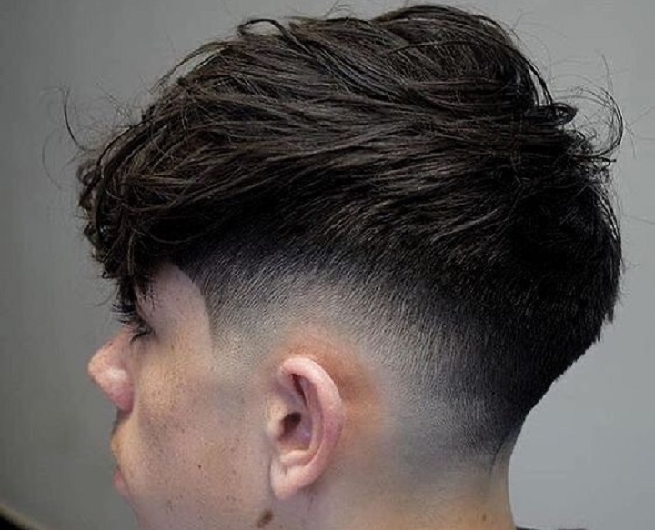 Textured Top With Med Fademid fade textured top haircut
mid fade top long
mid fade undercut long hair
