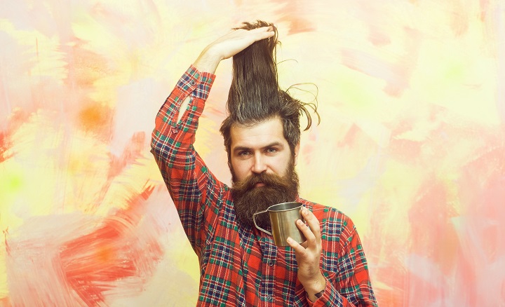 Bearded Man Holding Stylish Fringe Hair 