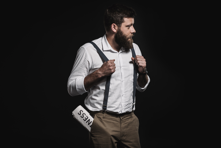 Bearded Man in a Suit Wearing Suspenders