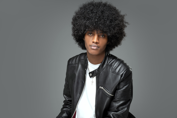 Black Man in Leather Jacket With Big Curly Afro Hair