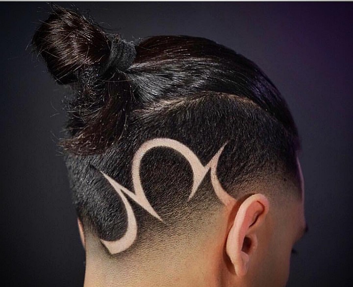 Bun And Signatureboys lines in hair
cool line haircuts
cross in haircut

