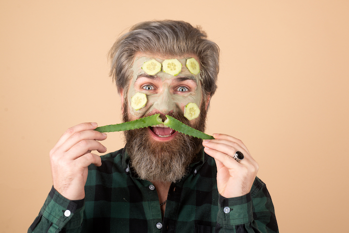 Goofy Bearded Man With Aloe Vera and Face Mask