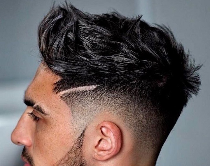 Head to Eyebrowmen's haircut two lines
men's haircut with letter design
men's haircut with line on side
