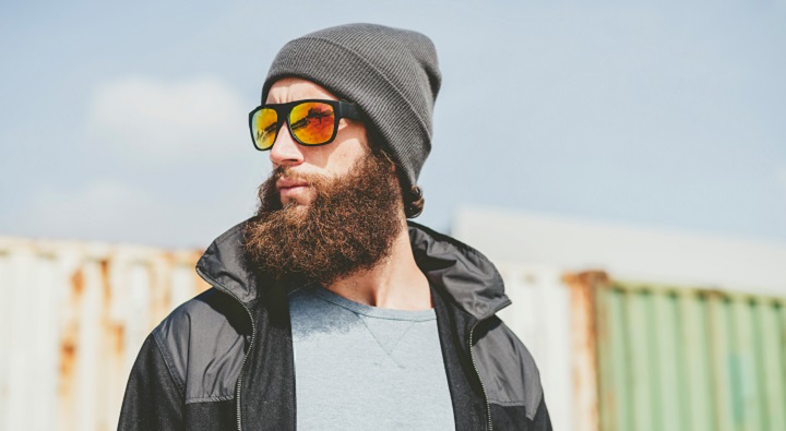 Hipster Man With Thick Full Beard Sunglasses and Hoodie