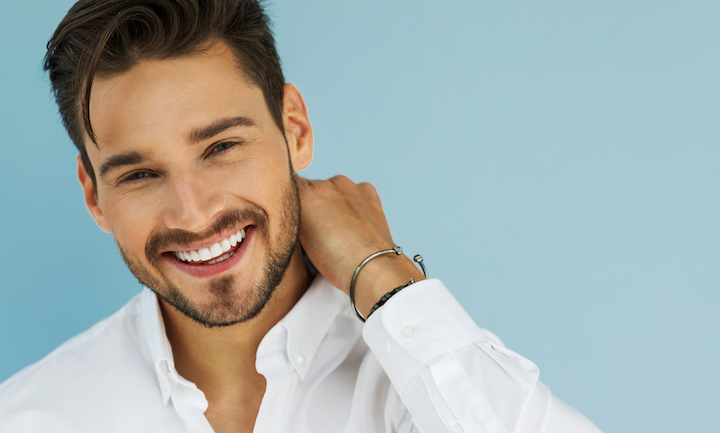 Smiling Guy In a White Shirt Wearing Short Beard