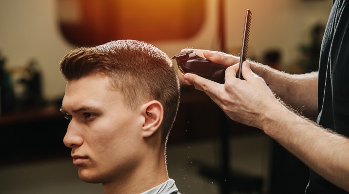 Cutting Androgynous Man's Hair With Clippers