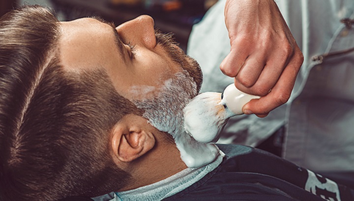 Barber Shaving Man's Beard