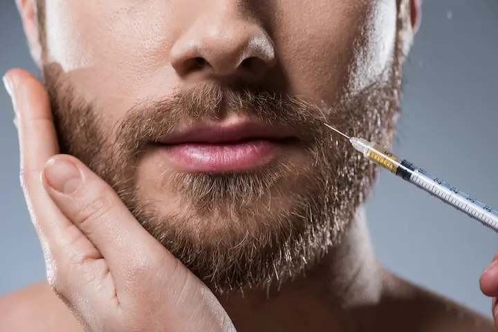 Injecting Needle in Man's Beard