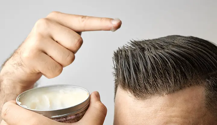 Scraping Wax From the Tin and Applying It to the Hair