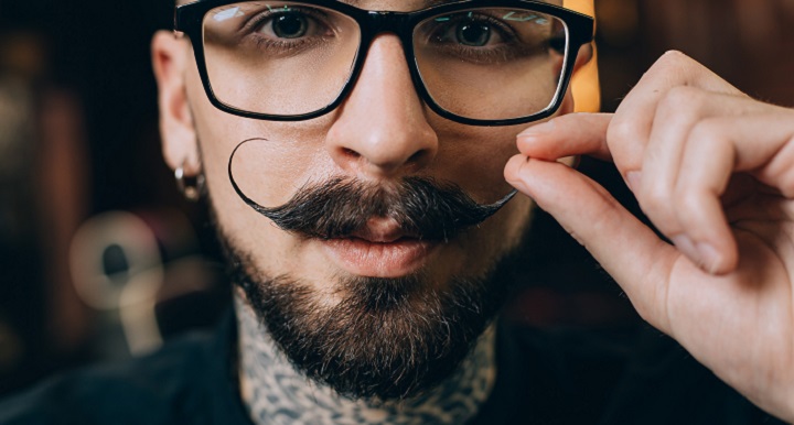 Man With Glasses Curling His Mustaches