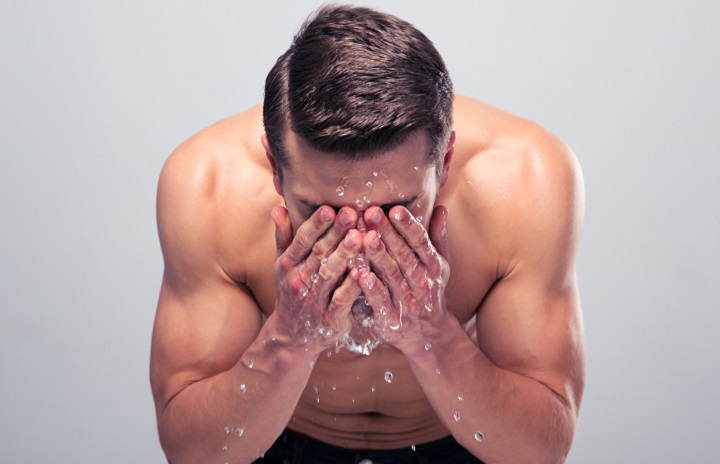 Man Washing His Face