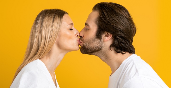Man With Beard Kissing a Woman