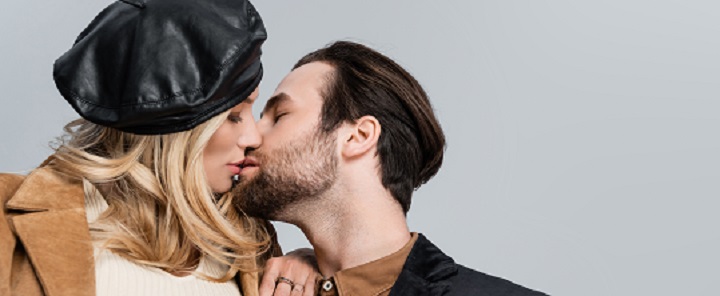 Man With a Beard Kissing a Woman