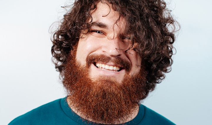 Smiling Man With Curly Ginger Beard