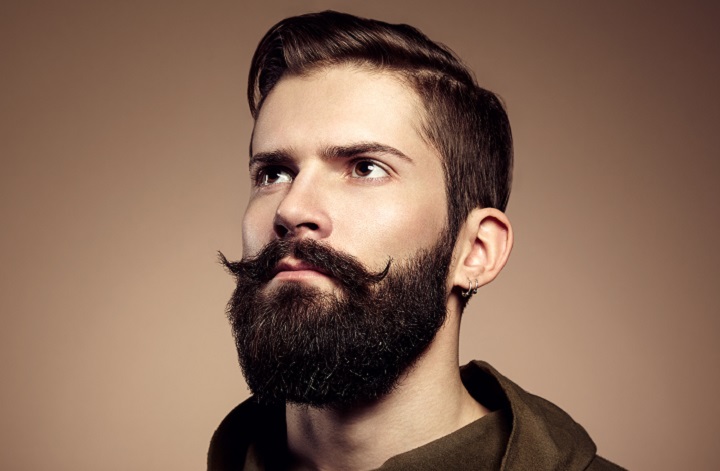 Serious Man With Thick Full Beard and Handlebar Mustache