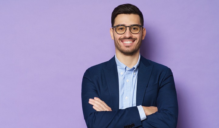 Smiling Young Man With Beard and Glasses