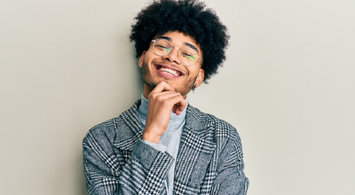 Smiling Black Man With Curly Hair Short Beard and Glasses