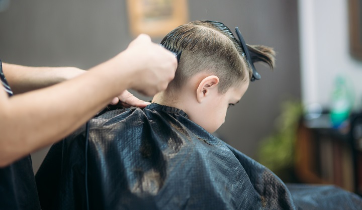 Trimming Little Boy's Hair at Hair Salon