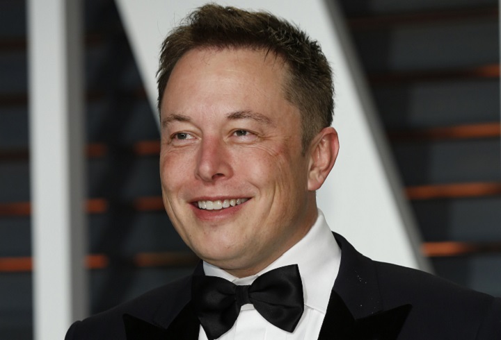 Smiling Elon Musk In a Suit With Bowtie