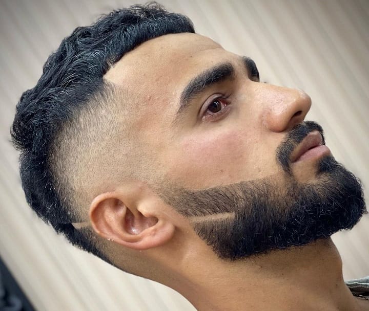 High Skin Fade, Textured Top and Thick Beard 