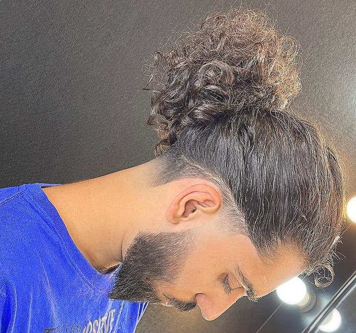 Low Fade And Curly Bun With Ducktail Beard