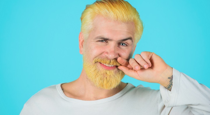 Man With a Bleached Beard and Hair Smiling