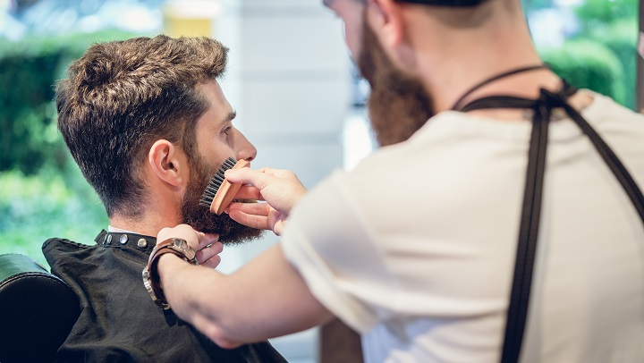 Barber Brushing Man's Beard