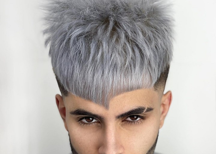 Man With a Grey Asymmetrical Hairstyle With Bangs