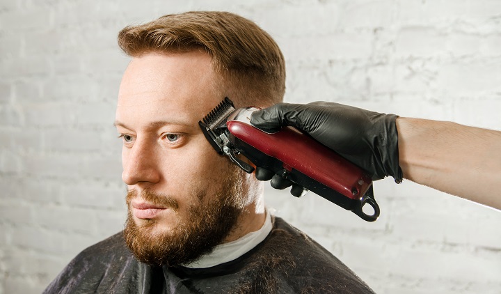 Trimming Man's Hair on the Sides With an Electric Trimmer