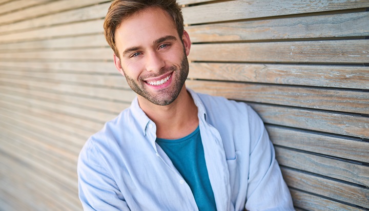 Smiling Young Man With Beard And Short Haircut