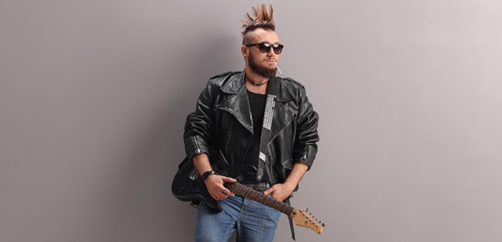 Punker With Spiky Hair in a Leather Jacket Holding a Guitar