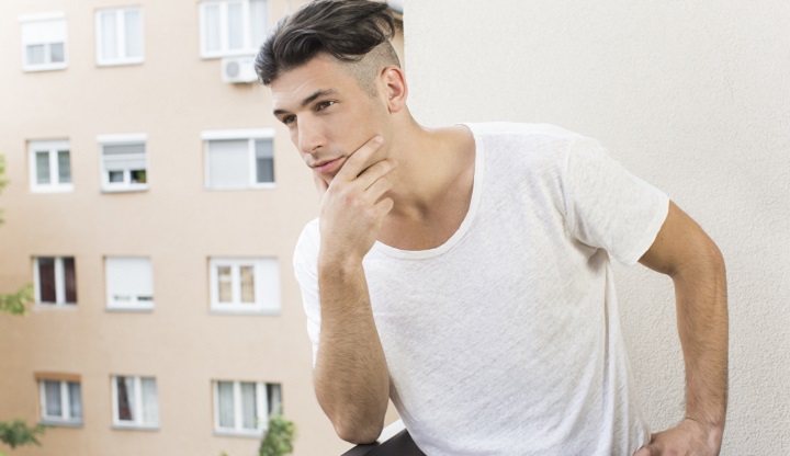 Pensive Guy With Undercut Slick Back Hairstyle