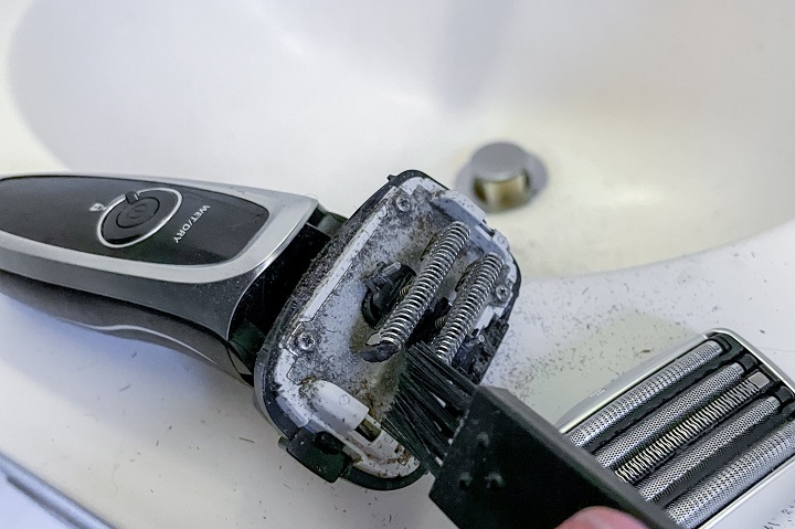 Cleaning an Electric Razor With a Small Brush