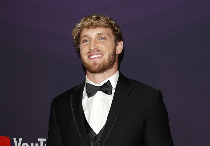 logan paul's hairstyle With Full Beard and Wavy Blonde Hair