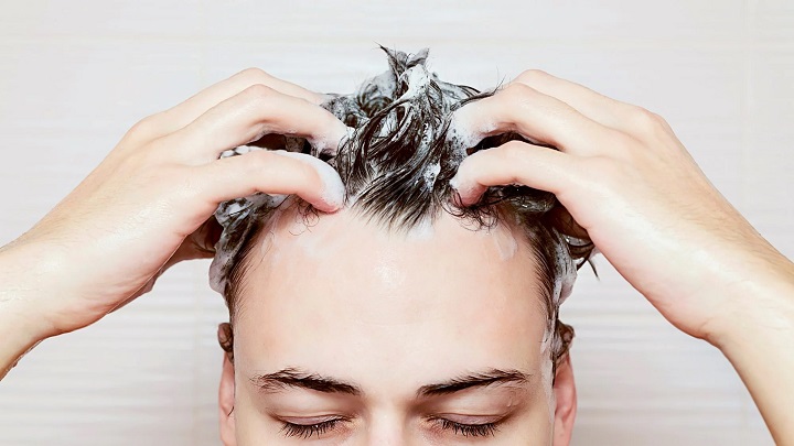 Man Shampooing His Hair