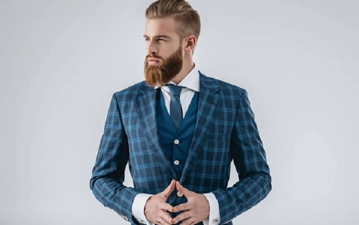 Man in a Blue Suit With a Full and Thick Ducktail Beard