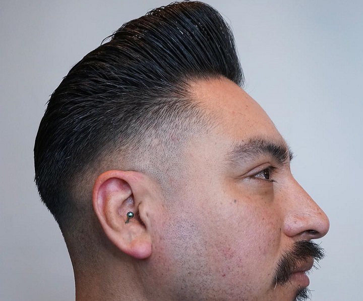 Man With a Mustache and Pompadour Hair