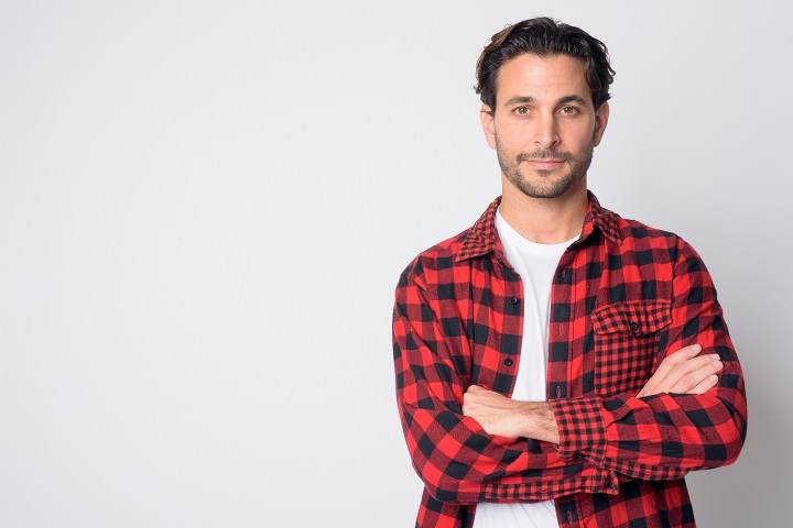Man in a Checkered Shirt Wearing Slicked Back Wavy Hair